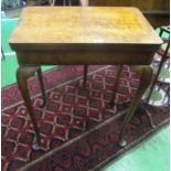 A walnut card table