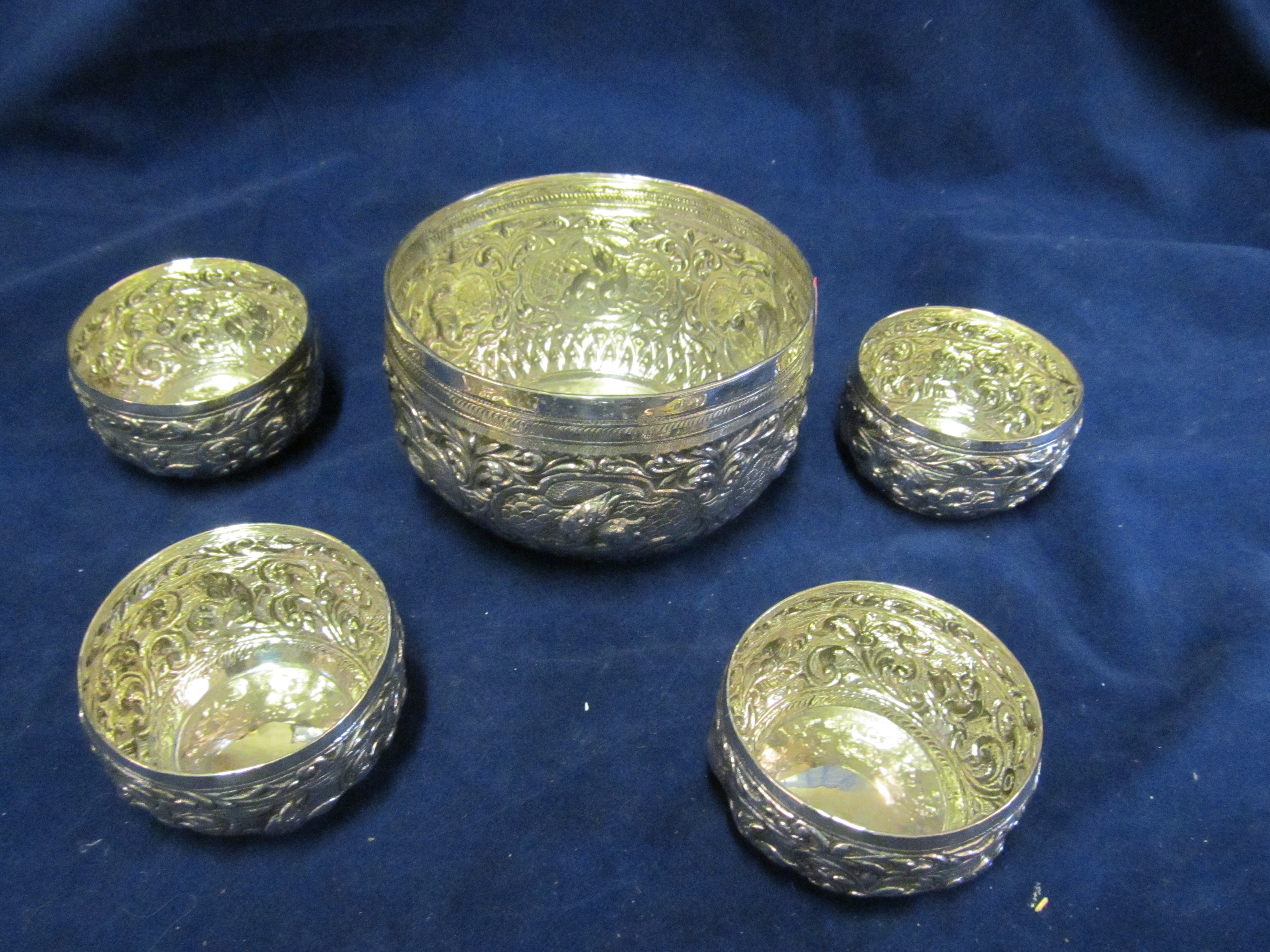 A silver bowl and four bowls