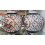 A pair of reproduction Chinese spherical vases decorated flowers