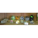 Five stamp paperweights, five pyramid paperweights and two others