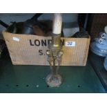 A brass lamp base and other items