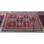 A rug red ground with geometric design
