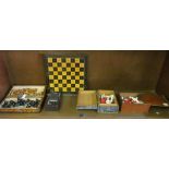 Two travelling chess sets and two small red and ivory coloured sets