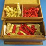 Two stained red and ivory coloured chess sets 2 ½” and 2”