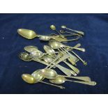 Twenty-two silver spoons and two pairs tongs