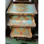 A nest of three painted tea tables