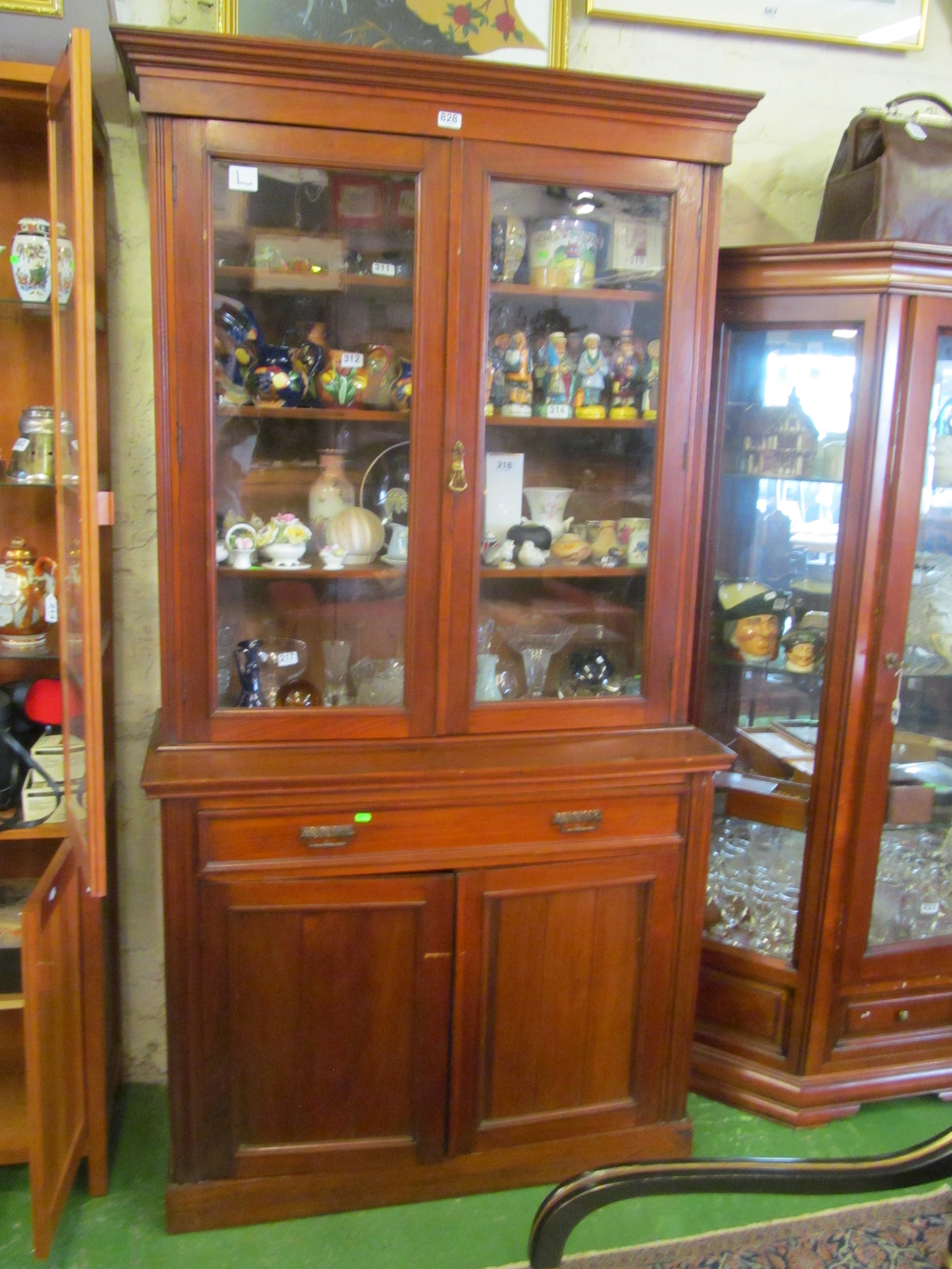 A 19th Century mahogany bookcase with drawer and two cupboards.