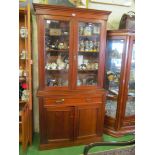 A 19th Century mahogany bookcase with drawer and two cupboards.