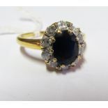 An 18ct gold sapphire and diamond cluster ring