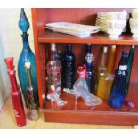 Various coloured glass bottles