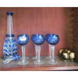A blue glass decanter stopper, six blue glass wines and six liquers