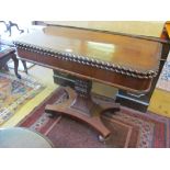 A 19th Century mahogany tea table.