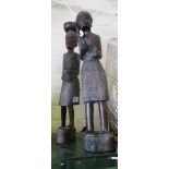 A pair of carved treen African figures.