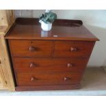 A mahogany chest of two short and two long drawers