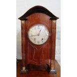 An Art Nouveau mahogany mantel clock eight day striking movement
