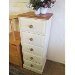 A tall chest of drawers