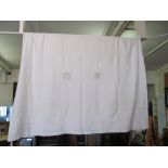 A white linen tablecloth with embroidered border 280 x 180cms