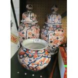 A pair of lidded Imari vases and a bowl