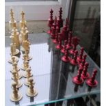 A red and ivory coloured chess set (one flag missing) 4 ¾”