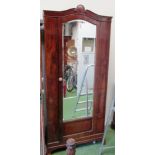 An Edwardian single door wardrobe