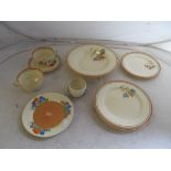 Various Clarice Cliff Bizarre plates, cups et cetera