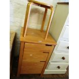 A bedside filing cabinet with three drawers and stool