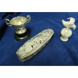 A silver lidded dressing table box (a/f), filigree bird on orb and a Challenge cup