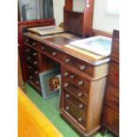 A 19th Century mahogany kneehole desk with eleven drawers