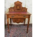 An Edwardian bonheur de jour/sewing cabinet with cupboard and two drawers, frieze drawer and