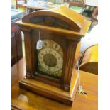 An oak mantel clock eight day chiming and striking movement