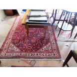 A Persian rug and a small rug