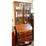 A walnut bureau bookcase