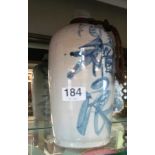 A stoneware pottery Oriental bottle with blue design