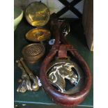 A brass compass, decorative brass box, brass nutcracker and horse brass on leather strap.