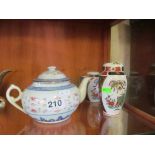 A Chinese teapot and two small jars