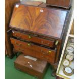 A mahogany bureau on cabriole legs