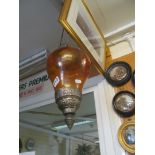 An amber glass ceiling light