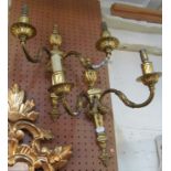 A pair brass two branch wall lights