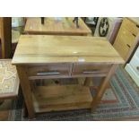 A small two drawer hall table with shelf under