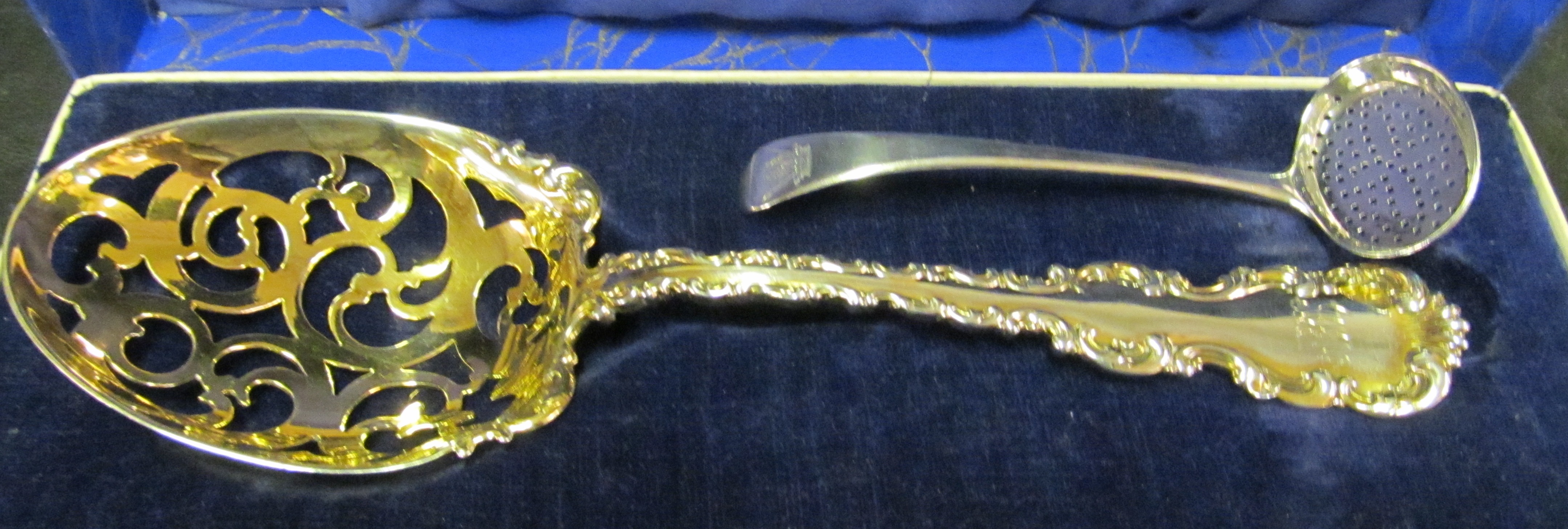 A sterling silver spoon and silver spoon