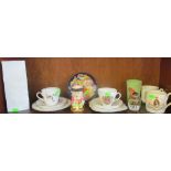 A 1953 Coronation trio, two mugs, a plastic beaker and other china