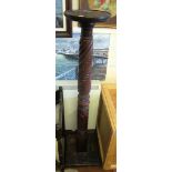 A mahogany torchere