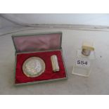 A mother of pearl compact lipstick and silver and ivory bottle