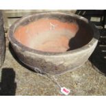 A shallow pottery garden pot