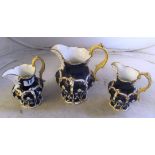 Three blue and white jugs