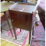 A mahogany bedside cabinet with gallery