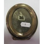 An oval silver frame