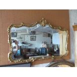 A gilt shaped mirror