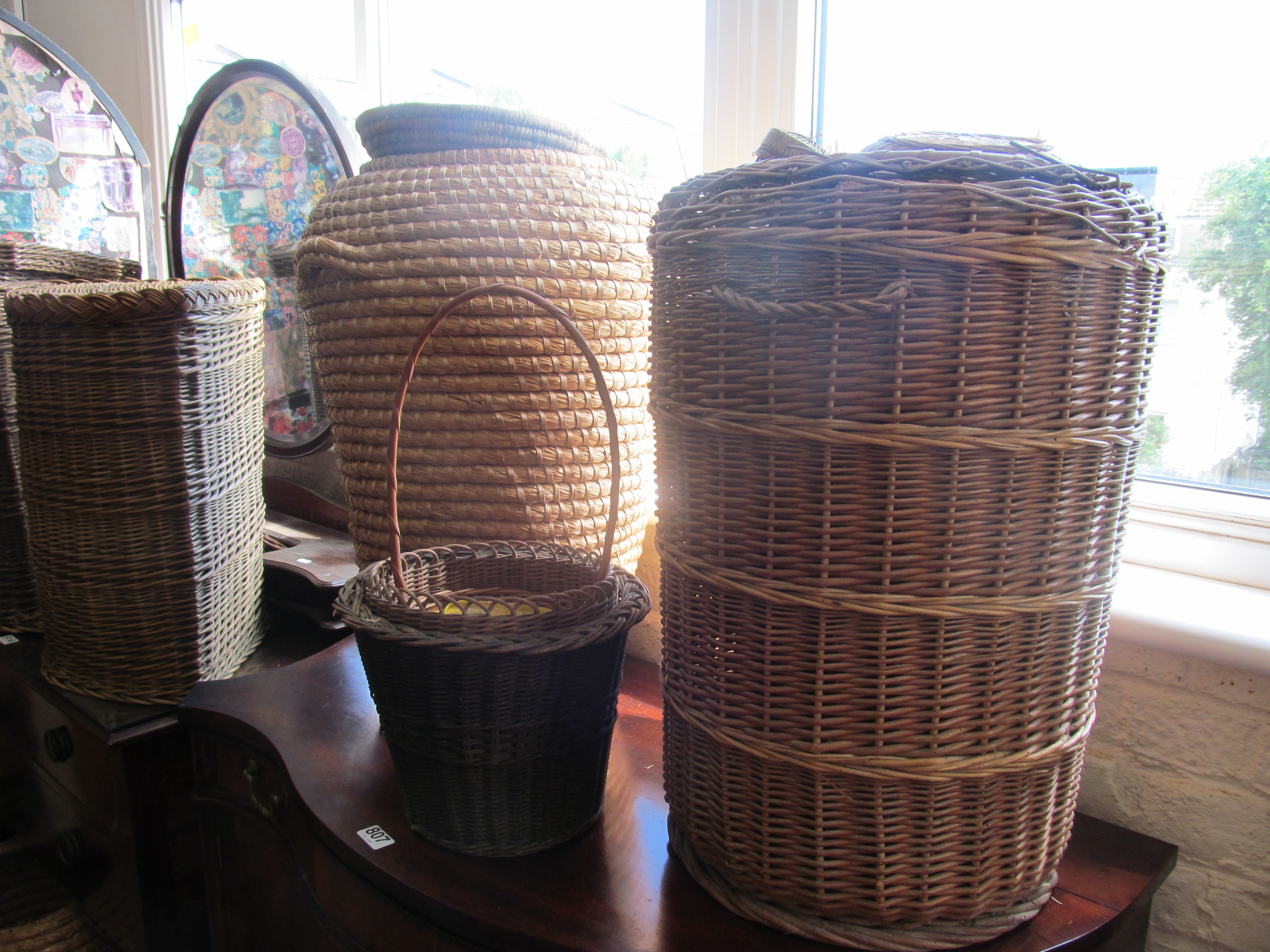 Two Aladdins wicker baskets and other wicker items