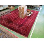 A Persian carpet red ground